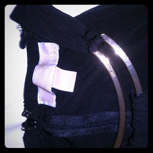 Black jumper with gold collar detail